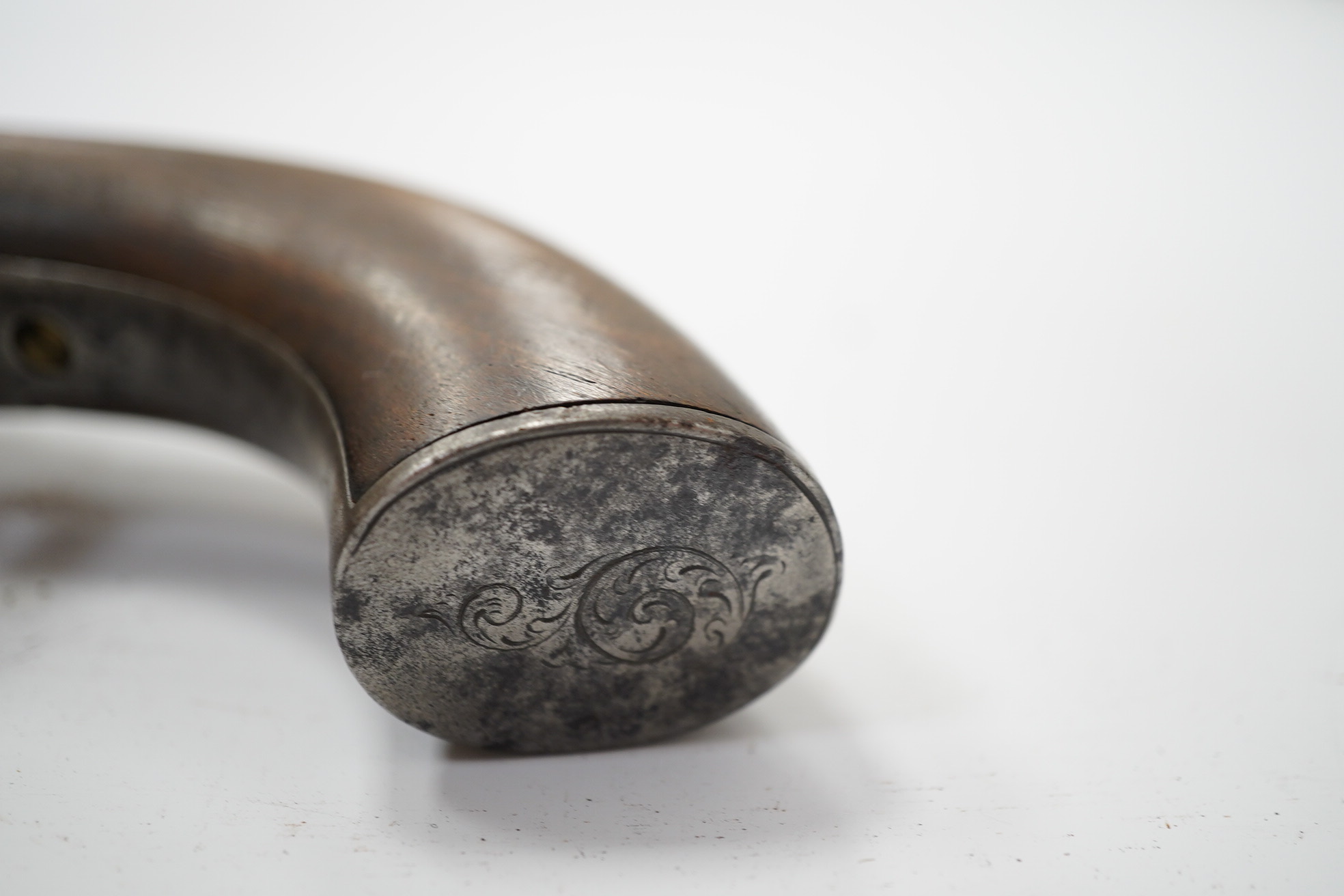 A six shot self-cocking percussion pepper box revolver, with fluted barrels, Birmingham proofed, round frame, and scroll engraved wooden grips, barrel 6.5cm. Condition - fair, alterations to the frame and grip.